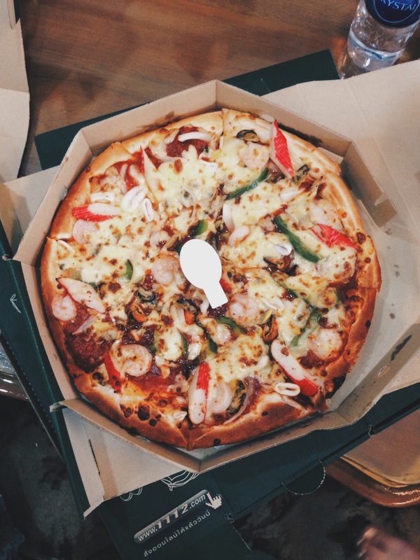 Colored Photograph of Seafood Pizza.